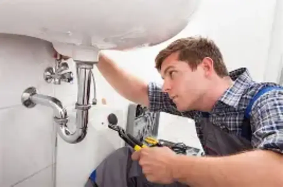 Phoenix plumber repairing a pipe during emergency plumbing service